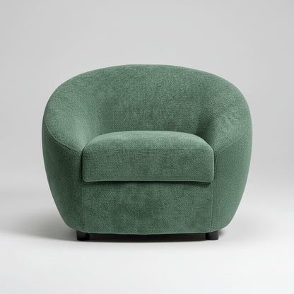 Green armchair in a room with a striped wall and a plant.