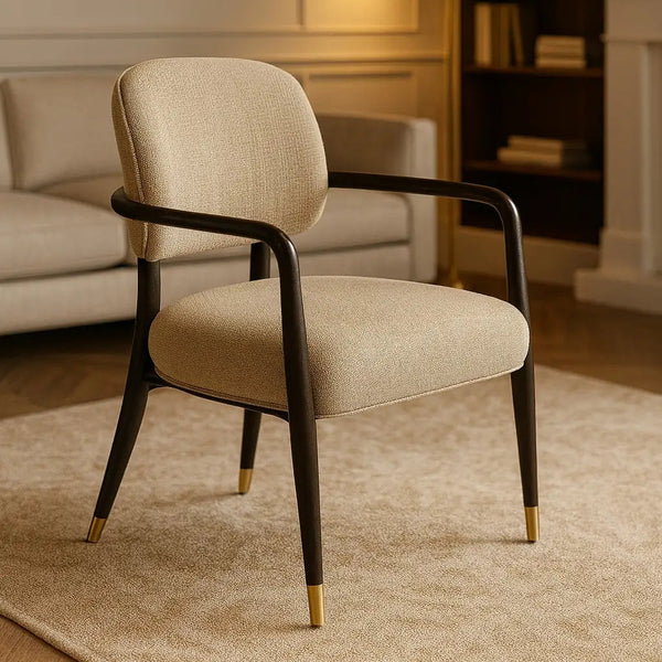 Beige armchair with black metal frame in a living room setting