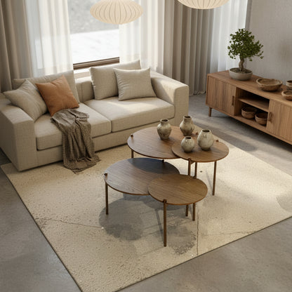Set of four wooden nesting tables on a concrete floor