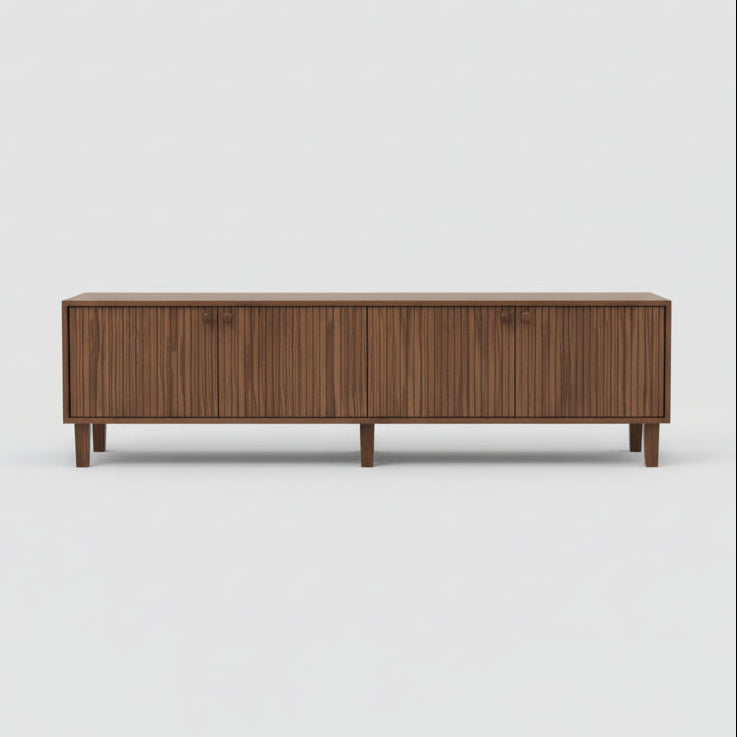 Modern living room with a wooden sideboard, armchair, and decorative items.